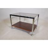 An MDA chrome, faux rosewood and tinted glass tea trolley by Howard-Miller Ltd, 24" x 16½" high