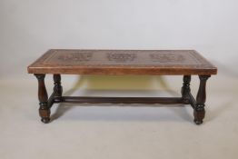 An Argentinian oak coffee table with embossed leather top, 17½"  x 48" x 20"