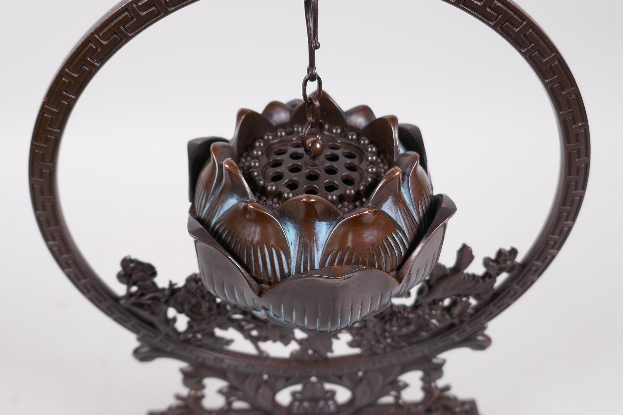 An Oriental bronze hanging incense burner in the form of a lotus flower, 10" high - Image 4 of 4