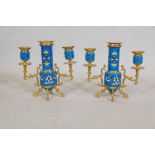 A pair of French enamel candlesticks with ormolu mounts, 7½" high
