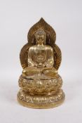 A Chinese gilt bronze of Buddha seated on a lotus throne, 4 character mark to base, 11" high