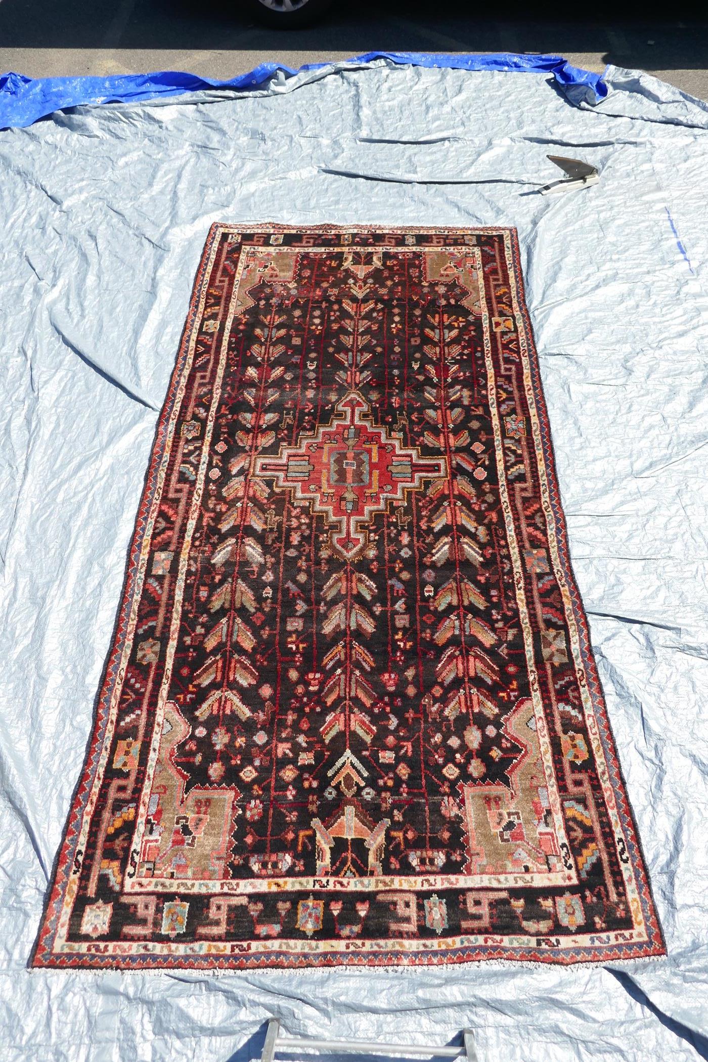 A multicoloured ground Iranian village rug with a bespoke all over design, 116" x 55" - Image 2 of 5