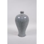 A celadon crackle glazed porcelain meiping vase of Chinese origin, 10" high