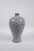 A celadon crackle glazed porcelain meiping vase of Chinese origin, 10" high