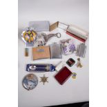 Miscellaneous items including a chrome and enamel AA badge, flasks, harmonica etc