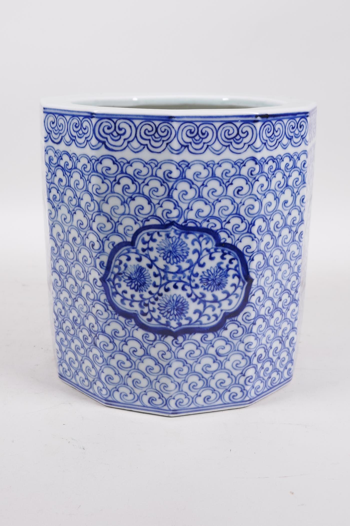 A Chinese Republic blue and white porcelain brush pot with decorative floral panels, 7" high x 7" - Image 3 of 5