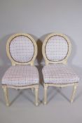 A pair of Victorian style balloon back chars with painted frames and Gingham upholstery