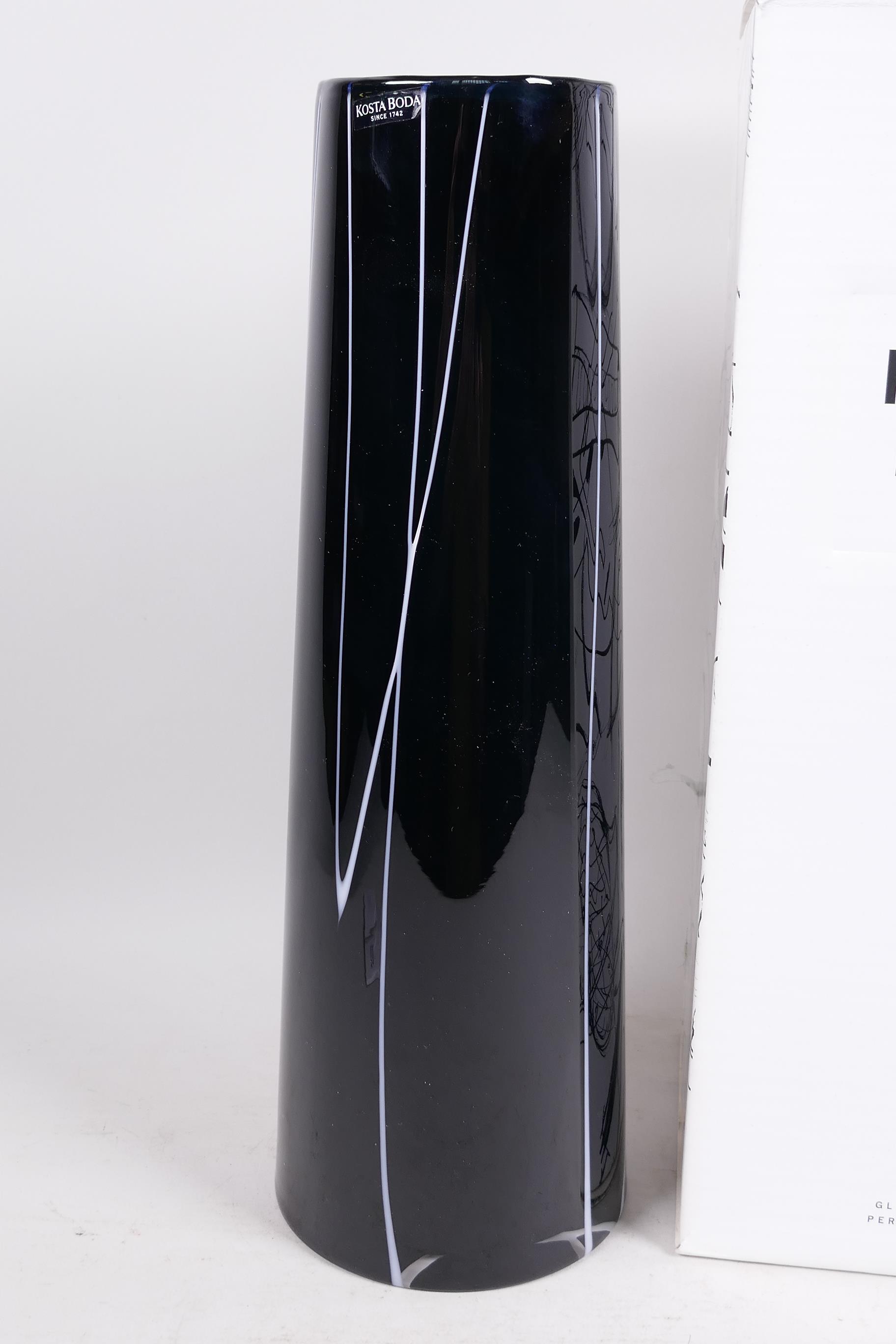 A tall Swedish Kosta Boda tapered cylindrical vase with white cut decoration on a black body, 13" - Image 2 of 3