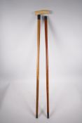 A C19th Malacca cane with a hallmarked silver mount, London, 1886, 35" long, and an early C20th