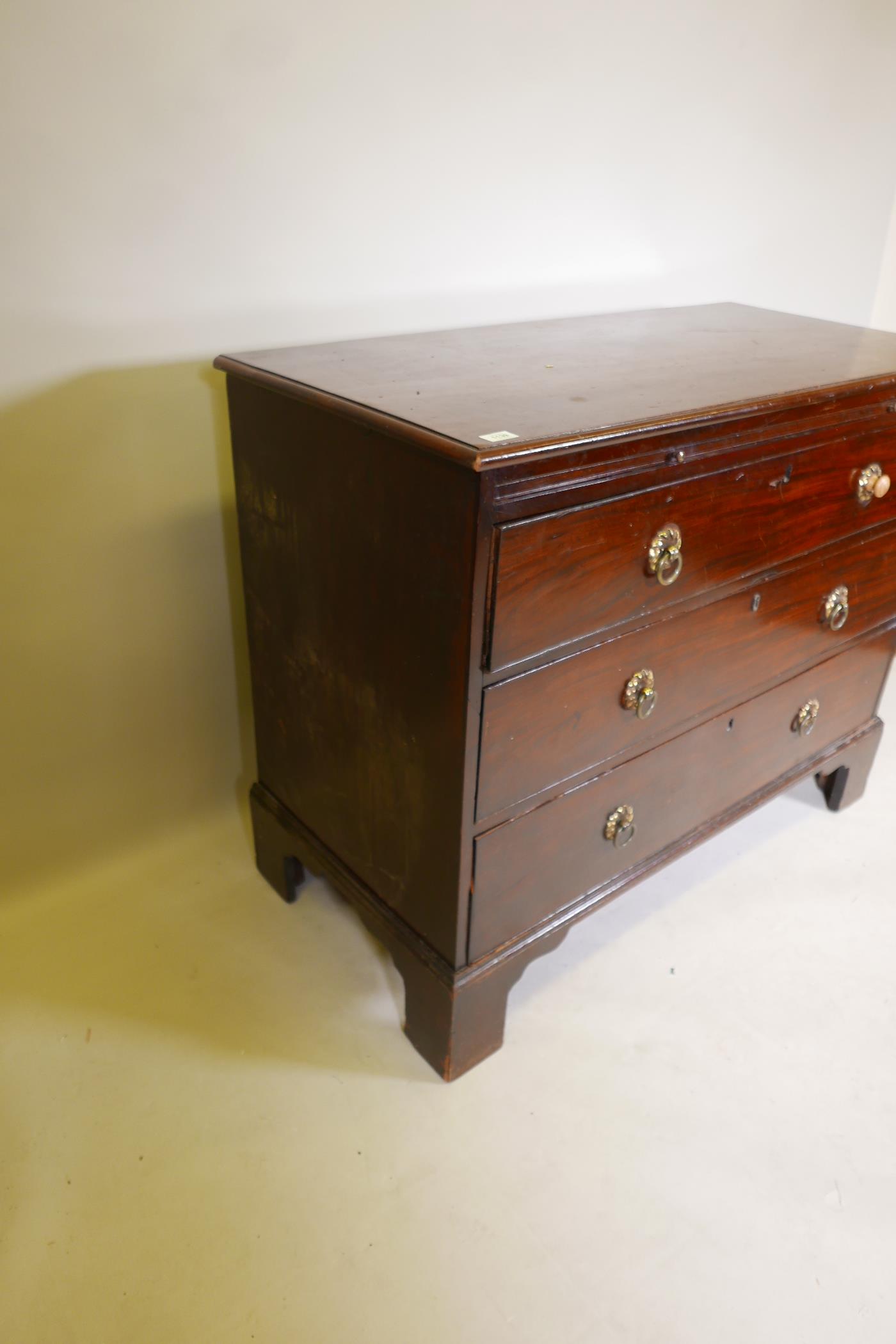 A C19th mahogany chest of three long drawers, under a brushing slide, raised on bracket supports, - Image 6 of 6