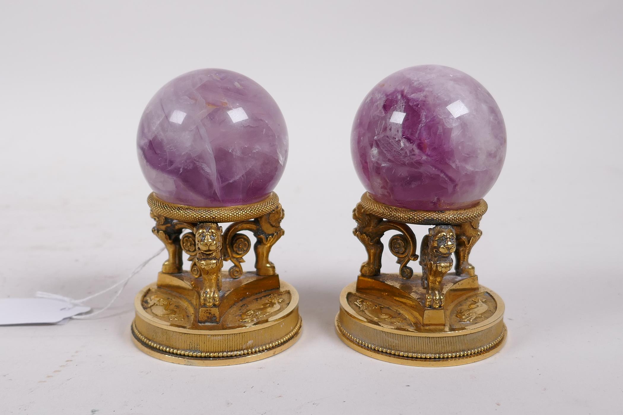 A pair of ormolu stands with lion supports, inset with crystal balls, 4" high - Image 3 of 4