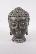 A Chinese bronze buddha head, 7" high