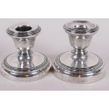 A pair of hallmarked silver dwarf candlesticks, Birmingham 1929, 2" high