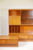 A 1970s retro wall unit and matching low side table with two drawers, largest 60" x 20", 63" high