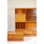 A 1970s retro wall unit and matching low side table with two drawers, largest 60" x 20", 63" high