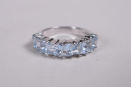 A 925 silver and blue topaz dress ring, approx size N/M