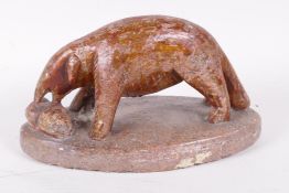 An African carved soapstone figurine of an aardvark, 7" long