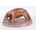 An African carved soapstone figurine of an aardvark, 7" long