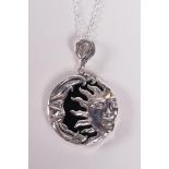 A 925 silver sun and moon pendant necklace backed with onyx, 1½" drop