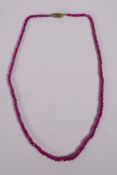 A graduated and faceted spinel bead necklace, 16" long