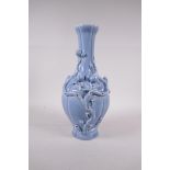 A Chinese blue glazed porcelain vase with applied fruiting peach tree decoration, seal mark to base,
