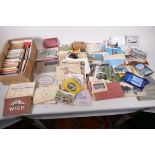A collection of postcard books and booklets, approx 140