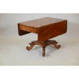 A C19th Continental mahogany sofa table with single end frieze drawer, raised on a square column and