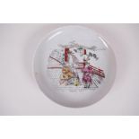 A Chinese porcelain dish, transfer printed with an erotic scene, early C20th, 6" diameter