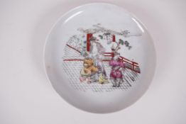 A Chinese porcelain dish, transfer printed with an erotic scene, early C20th, 6" diameter