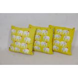 Three yellow Habitat 'Topsy' elephant patterned cushions, 17" x 17"