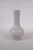 A Chinese pottery bottle vase with a Ge ware style glaze, 7" high