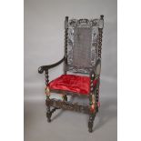 A C19th open armchair with carved and pierced back, barleytwist columns and supports, and scroll