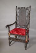 A C19th open armchair with carved and pierced back, barleytwist columns and supports, and scroll