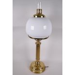 A brass and glass electric table lamp made in the style of an oil lamp, 26" high