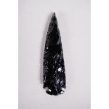 An obsidian spear head, 5" long