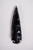 An obsidian spear head, 5" long