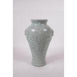 A celadon Ge ware (crackle glazed) pottery meiping vase with two mask handles, seal mark to base,