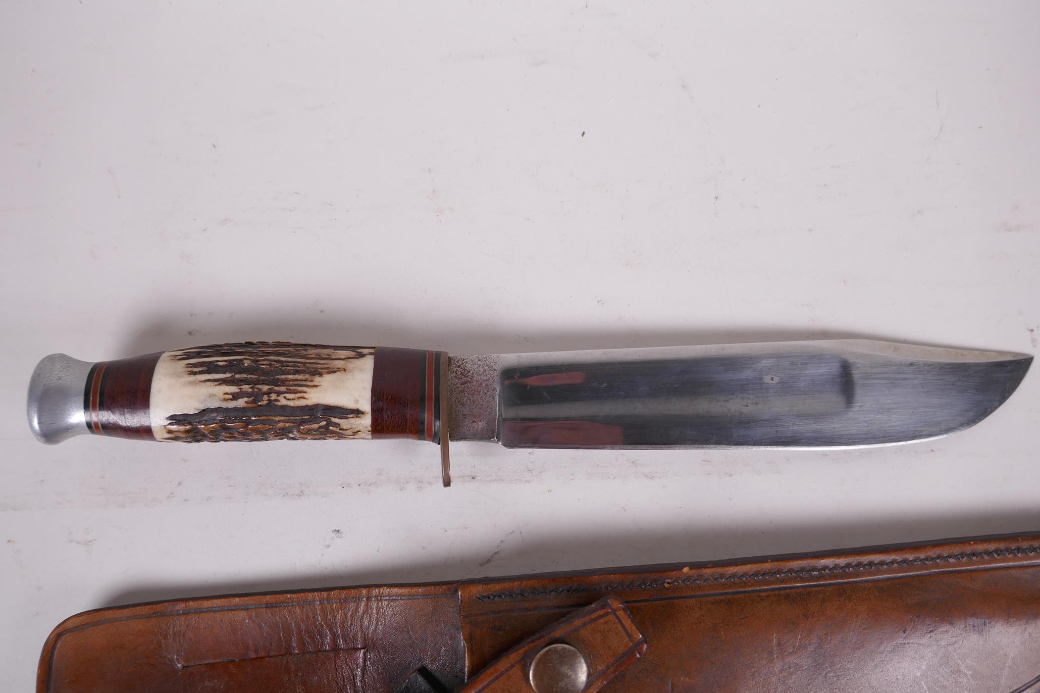 A Bowie knife by J. Nowill & Sons, Sheffield, with 8" blade and antler handle in a fitted leather - Image 2 of 3