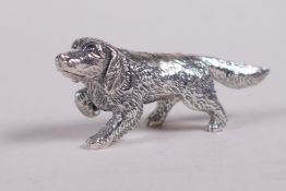 A sterling silver figure of a spaniel, 1½" long