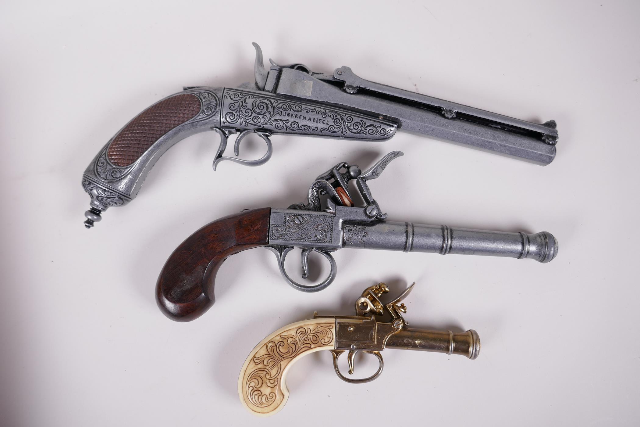 Two replica flint lock pistols and a replica duelling pistol, 13" long