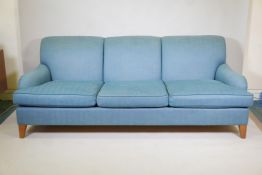 A good quality Howard style three seater sofa, raised on tapering supports, 88" x 43" x 33"