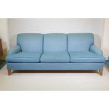 A good quality Howard style three seater sofa, raised on tapering supports, 88" x 43" x 33"