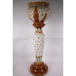 A Burmantofts faience jardiniere on stand, No 2103, signed, 33" high, A/F