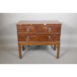 A mahogany three drawer chest of drawers on an adapted stand, 32" high, 37" wide, 18" deep