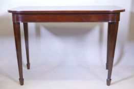 An early C19th mahogany console table on square tapered supports with spade feet, 30½" high x 44"