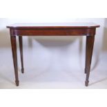 An early C19th mahogany console table on square tapered supports with spade feet, 30½" high x 44"