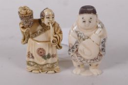 Two Japanese carved bone netsuke in the form of men, signed