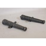 A pair of antique cast iron cannons, 23" long