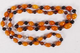A string of butterscotch and cherry amber beads, 36" long (40g)