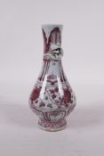 A Ming style red and white pottery vase with climbing kylin decoration to neck, 6" high